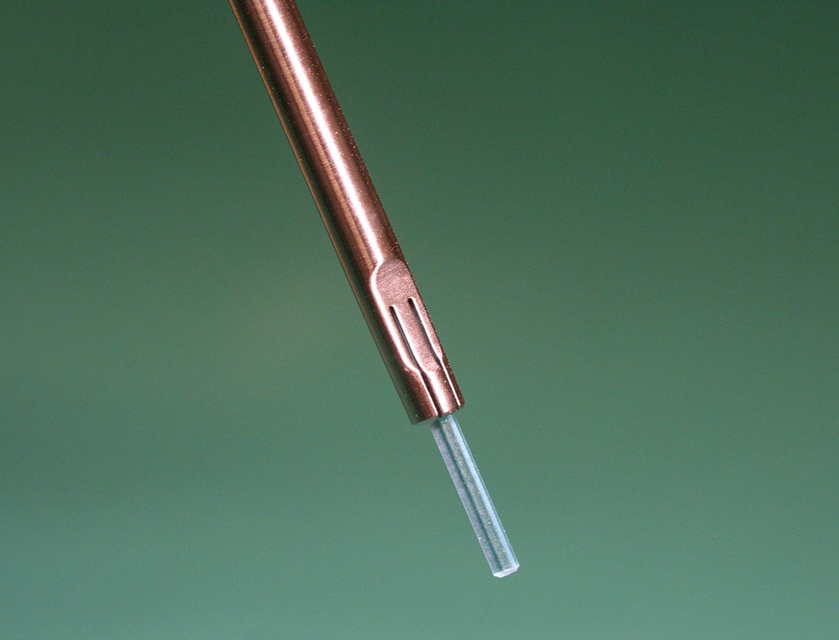 Blue bioabsorbable pin attached to an appropriate surgical instrument.