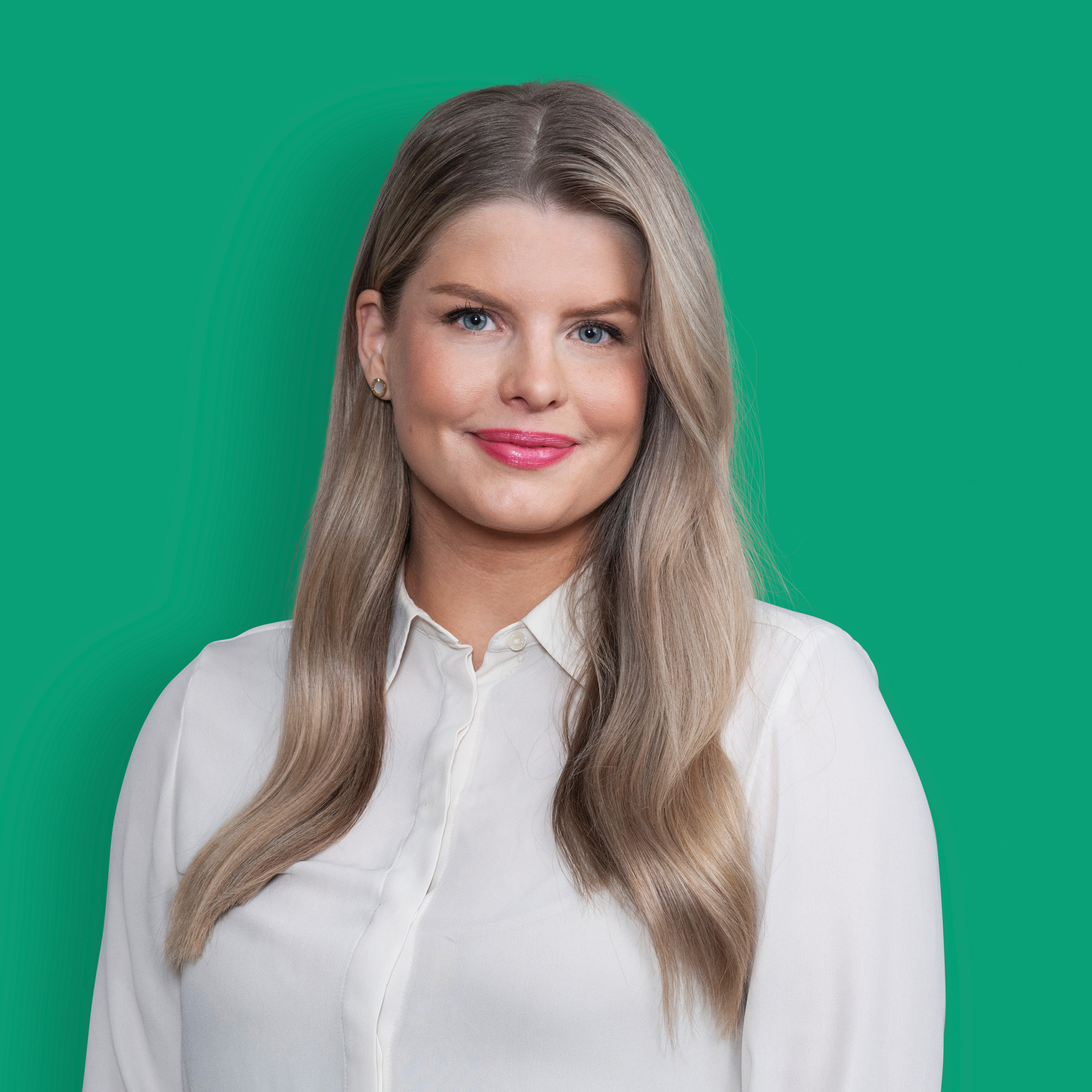 A portrait of a smiling person from the marketing team of experts in white shirt against green background. 